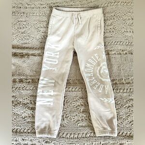 Abercrombie kids girls logo sweatpants, size 9/10, wheat w/white lettering